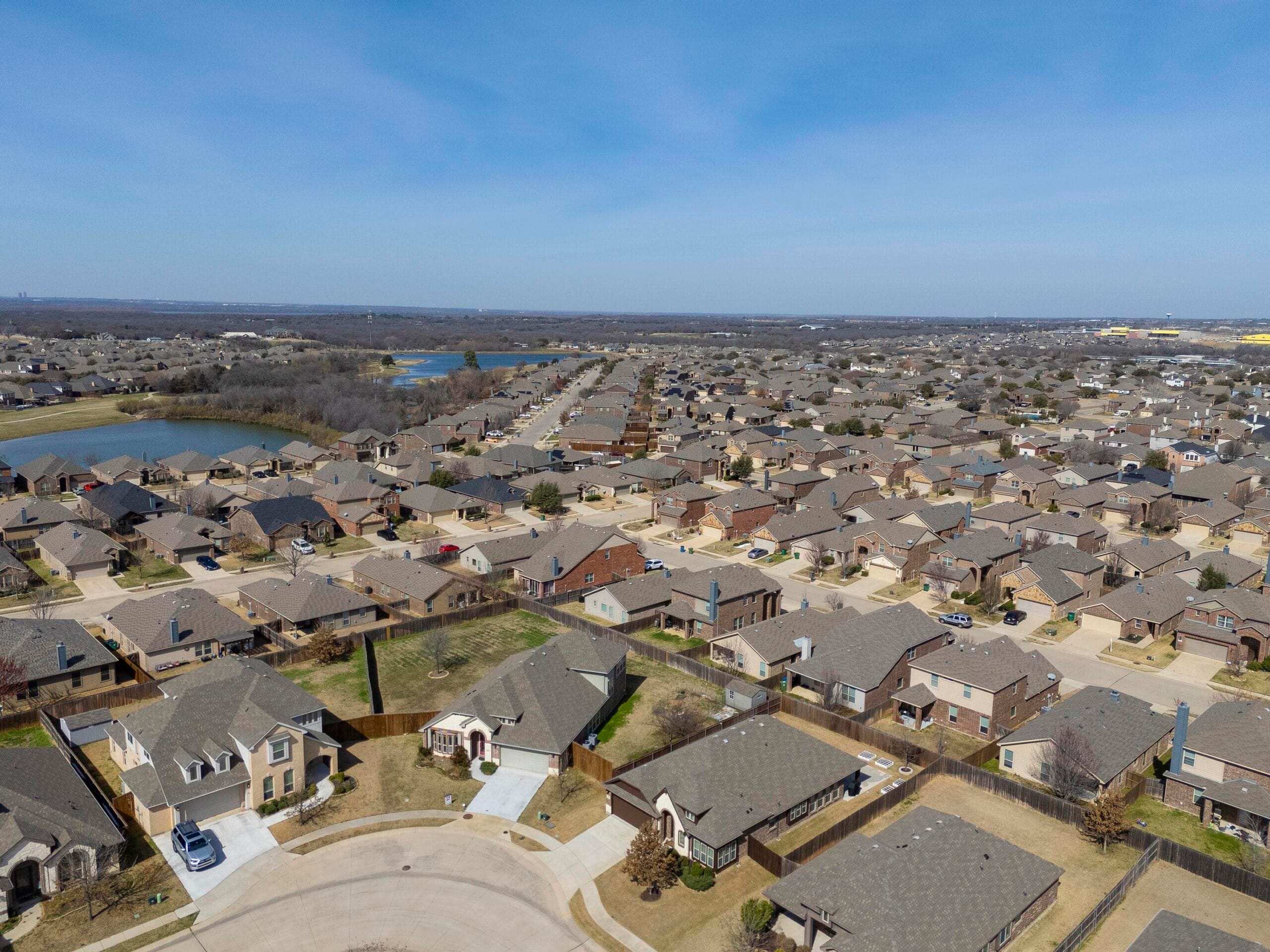 What are the current average home prices in Dallas-Fort Worth? 2 North Texas neighborhood aerial view showing how location affects home prices