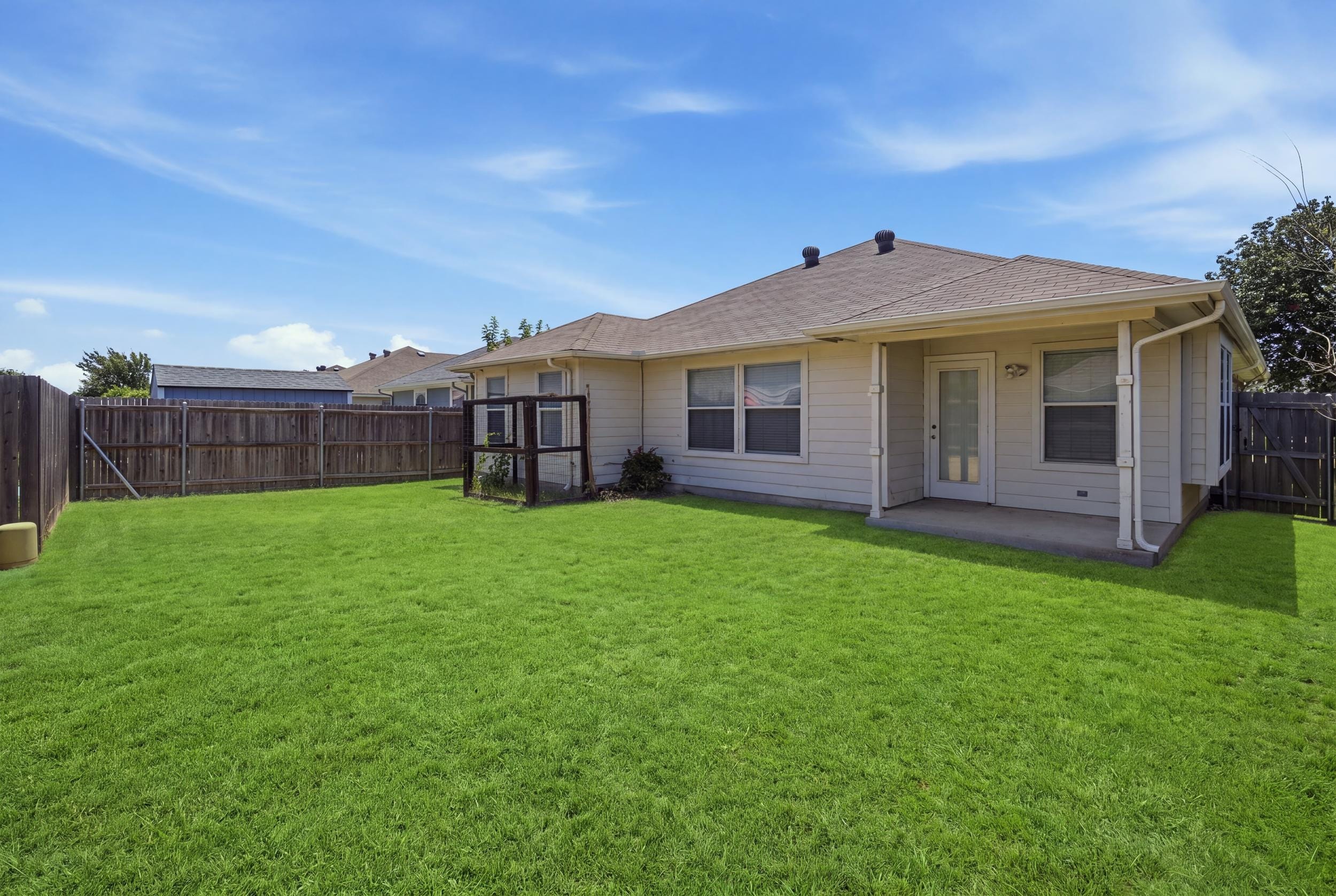 9612 Linton Drive, Fort Worth, Texas 76108 16 Fenced backyard and covered patio at 9612 Linton Drive
