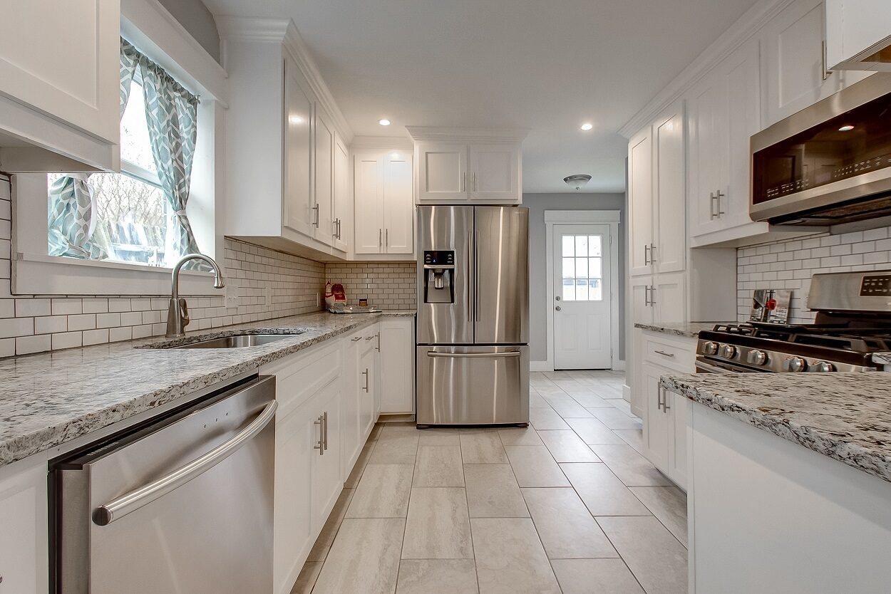 4608 Lafayette Avenue, Fort Worth, TX 76107 - Seller 14 Kitchen with granite counters and white cabinets at 4608 Lafayette Avenue