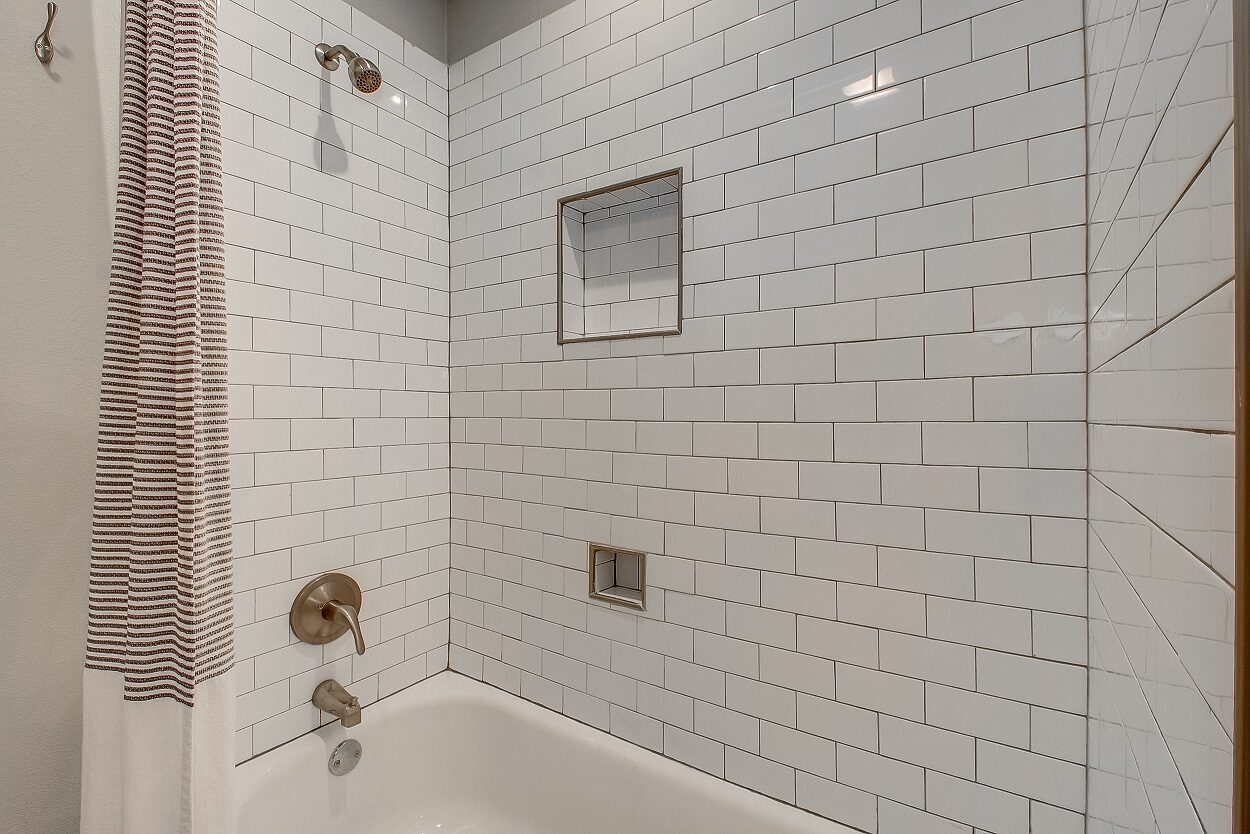 4608 Lafayette Avenue, Fort Worth, TX 76107 - Seller 24 Tiled bathtub and shower at 4608 Lafayette Avenue